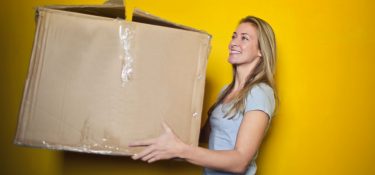 woman holding moving box
